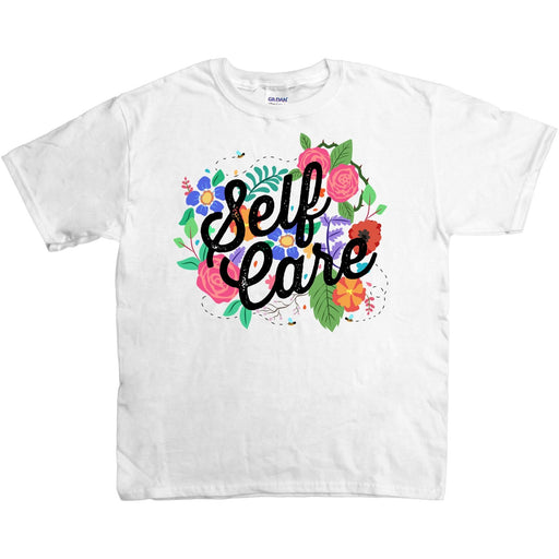 White t-shirt with illustration of flowers and the words Self Care